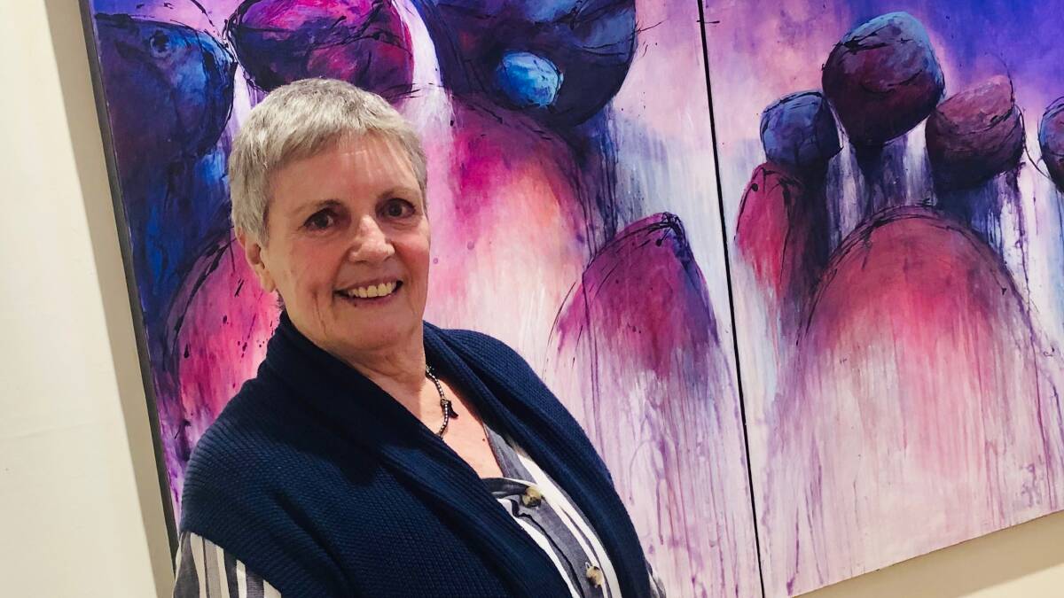 COMING SOON: Val Wilkinson with one of her nature-inspired paintings at her 'Between a Rock and a Vast Space' exhibition at the St Arnaud Raillery Hub. Picture: CONTRIBUTED