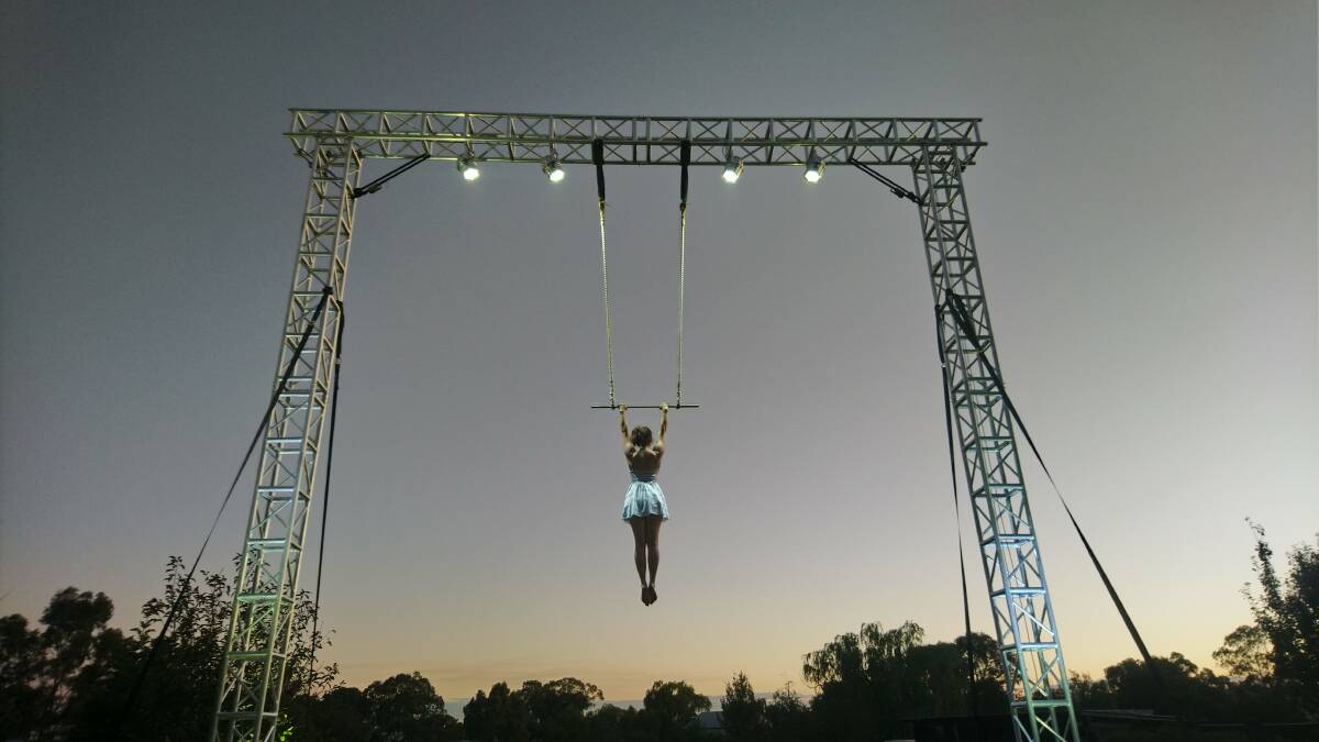 HIGH-FLYER: Caz Walsh in action on the trapeze. PICTURE: Contributed