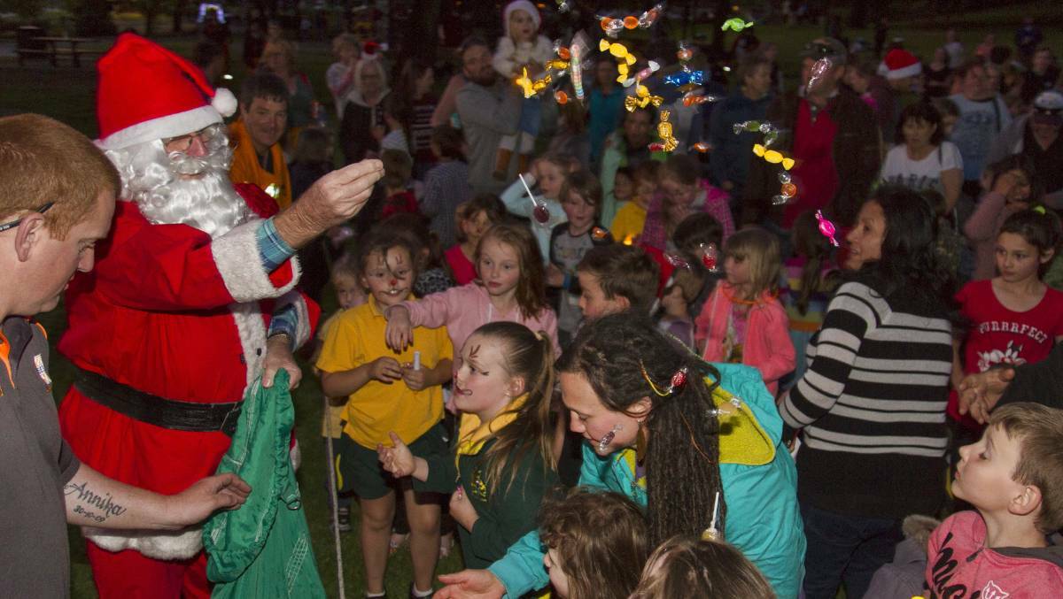 PRESENTS: The ever-popular Santa distributes lollies at Ararat's Carols by Candlelight IN 2019. Picture: PETER PICKERING
