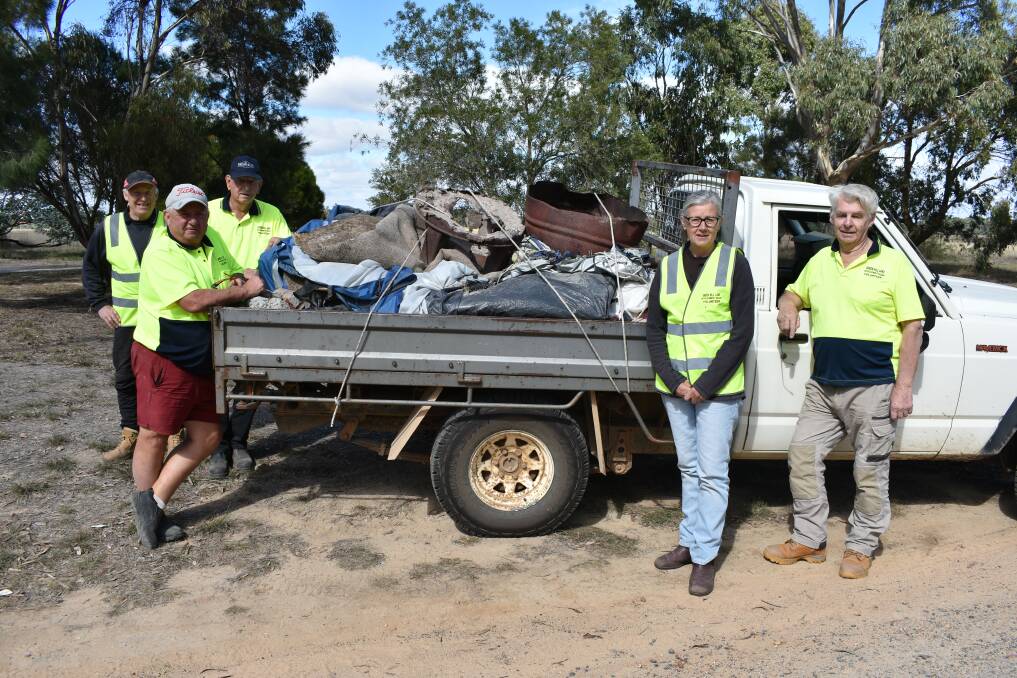 FED UP: Green Hill Lake Devlopment Committee volunteers kept busy picking up rubbish. Picture: James Halley