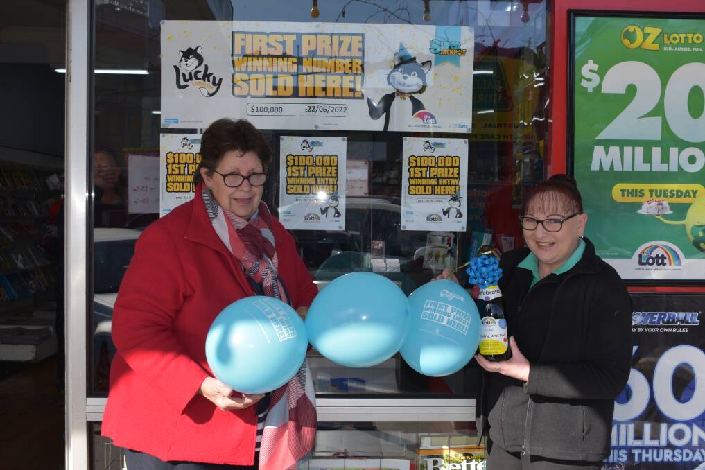WINNER: Staff at Harris Newsagency where the winning ticket was purchased. Picture: JAMES HALLEY