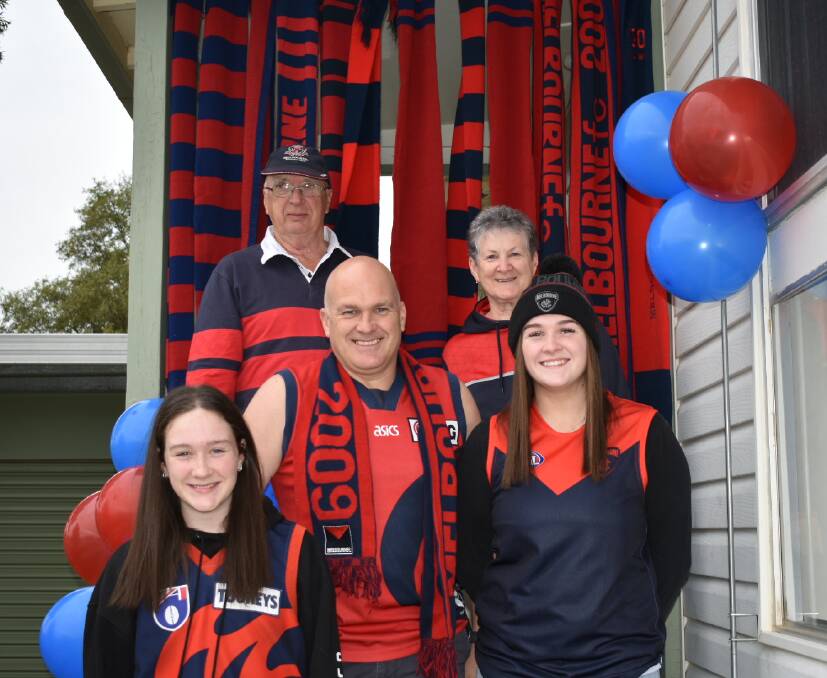 FAMILY: It's a family affair for the Nathan Shalders with father (Neville Shalders) top left, mother (Anne Shalders) top right, and daughters (Inika and Miley Shalders) all barracking for the Demons. Picture: JAMES HALLEY