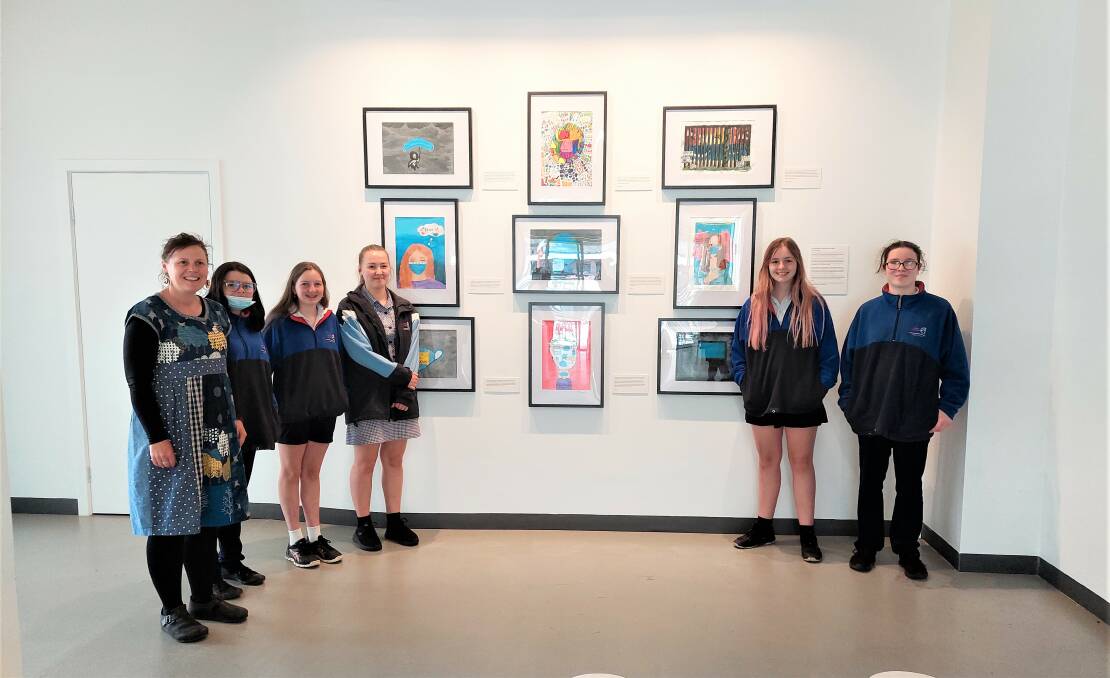 PROUD: Ararat College students with their artworks. Picture: CONTRIBUTED. 