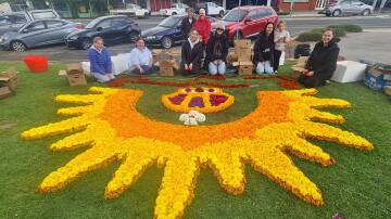 Nareen Boyd, Tracey Bell, Emma Horratek, Tracey Bushby, Annie Brown and Marlee Walker, Lisa Cameron, Vicki Boyd, and Penny Jones spent Wednesday afternoon creating the floral carpet tribute in readiness for the Ararat ANZAC Day services, 2024. Picture by Sheryl Lowe