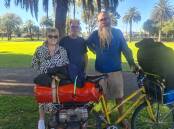 Ros and Stuart Ross welcomed Michael Whitty to Horsham during his 30,000-kilometre ride around the globe. Picture by Sheryl Lowe