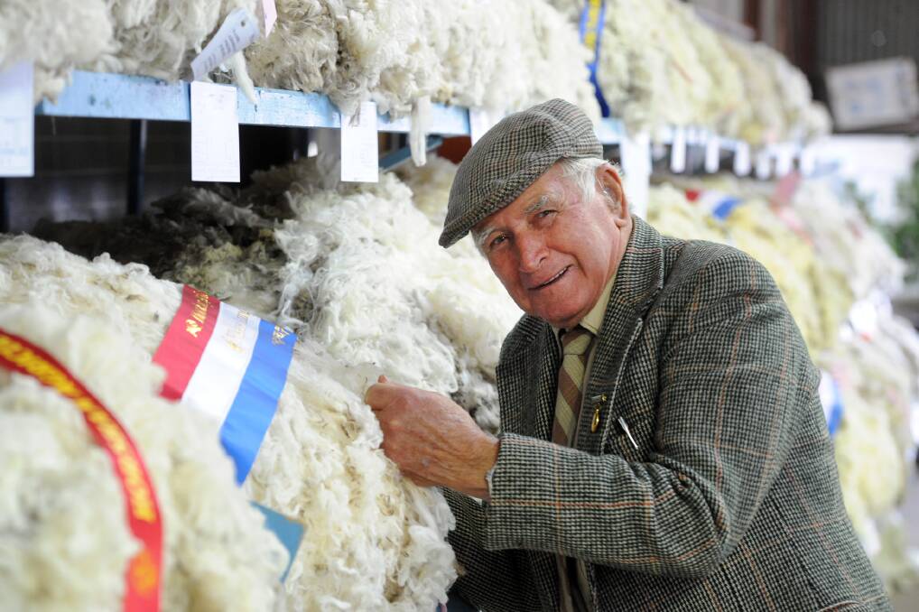 HIGH QUALITY: Bob Jackman checks a fleece at the Horsham Show on Sunday. The Wimmera Legacy Fleece Championships were on again at the show this year. Picture: PAUL CARRACHER