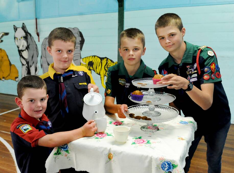 SPOONFUL OF SUGAR: Horsham scouts Lachlan North, Aiden North, Tommi Roberts and David Roberts prepare for high tea. Picture: SAMANTHA CAMARRI