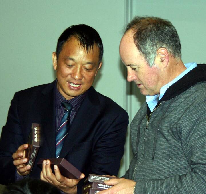 GIFT: Ararat Rural City Mayor, Cr Paul Hooper exchanges goods with Deputy Secretary-General Jin Deneng of the Chuxiong Yi District in Yunnan province, southwest China.
