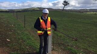 HARD AT WORK: Terry Young of Dale Bell Fencing, which was one of the first Ararat businesses to secure labour during construction of the $450 million Ararat Wind Farm.