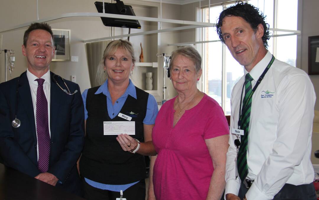 Funds raised: Oncologist Dr Craig Carden, Marg Hall, Robyn Vowels and EGHS chief executive Nick Bush at the presentation of the cheque.