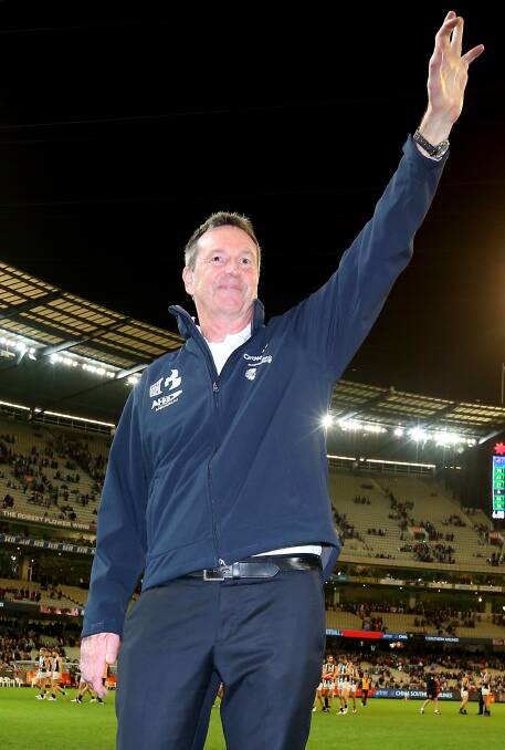 FIGHTING: Neale Daniher waves to the crowd during Melbourne and Collingwood's round 10 clash during the 2015 AFL season. Picture: GETTY IMAGES