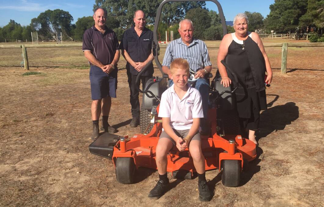 RIDE-ON: Ararat Rural City Council mayor Paul Hooper, Ararat Mower Centre owner Barry McLoughlin, and pony club members Darcy Woodfine, John Woods and Tina Wylde. Picture: Adam Hill