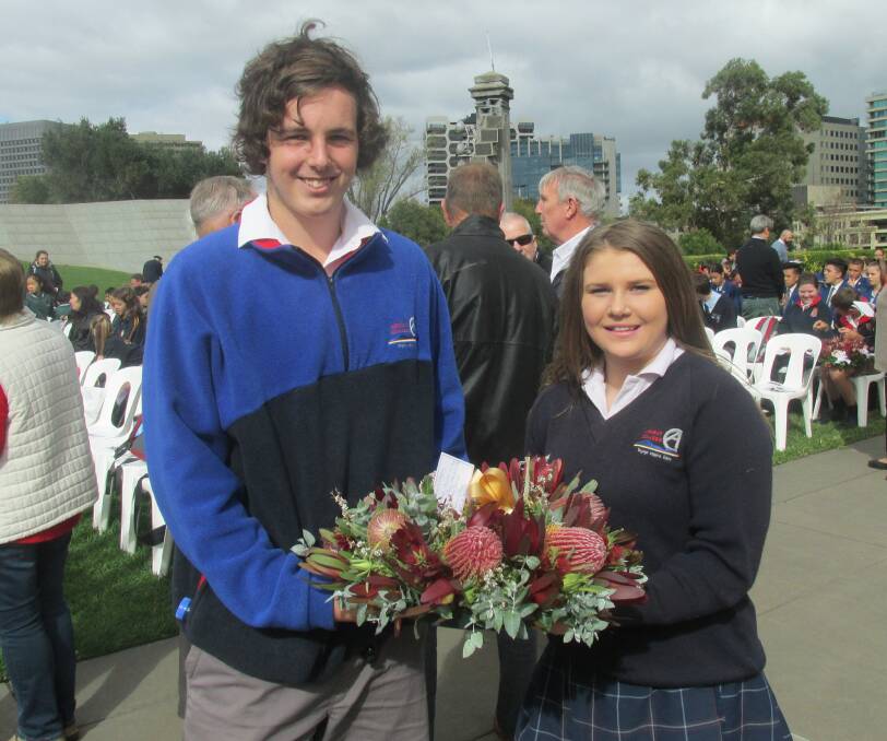 LEST WE FORGET: Ararat College wreath bearers Josh Fiegert and Maryanne Pitts at the ceremony in Melbourne. Picture: CONTRIBUTED