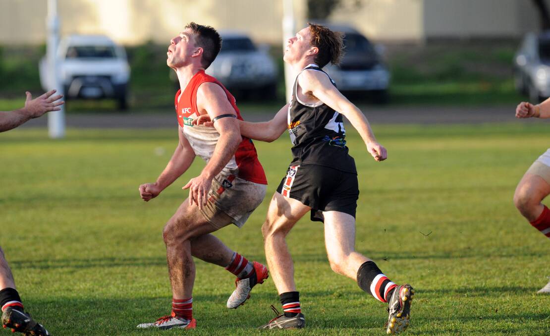 Ararat's Daniel Mendes watches the ruck contest in front of Saint Hugh Gove in round 13. Picture: PETER PICKERING