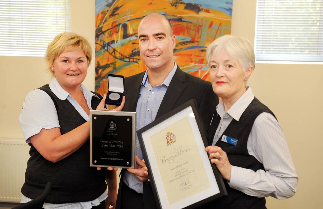 GRINNING: Ararat Medical Centre's Vicki Parsons, Garry Hurst and Denise McGrath with the awards the centre won at the Royal Australian College of General Practice awards night. Picture: Paul Carracher