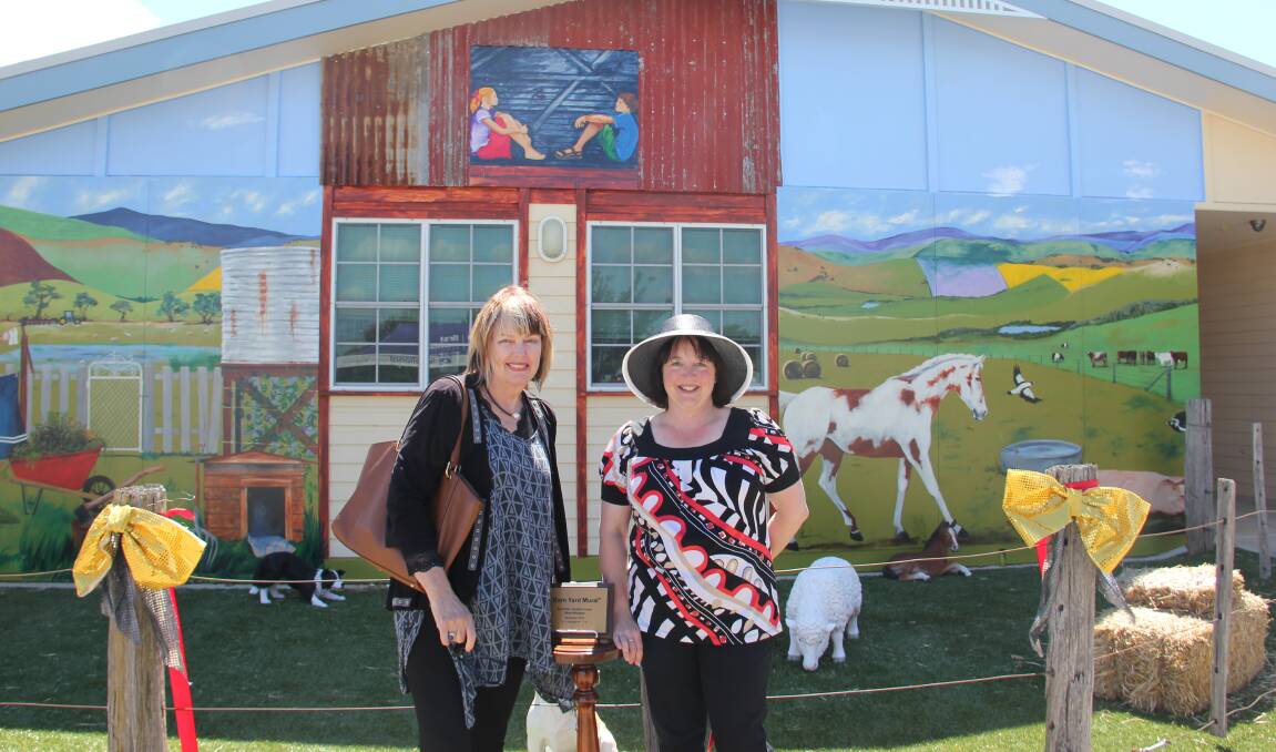 COLOUR: Ararat artist Janette Lucas and 70 Lowe Street manager Tanya Haslett at the launch of the barnyard mural.