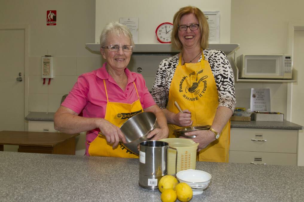 MIXING: Carole McGregor and Phillipa Hale prepare for Pancake Day at Ararat's St Andrew's Uniting Church. Picture: Peter Pickering