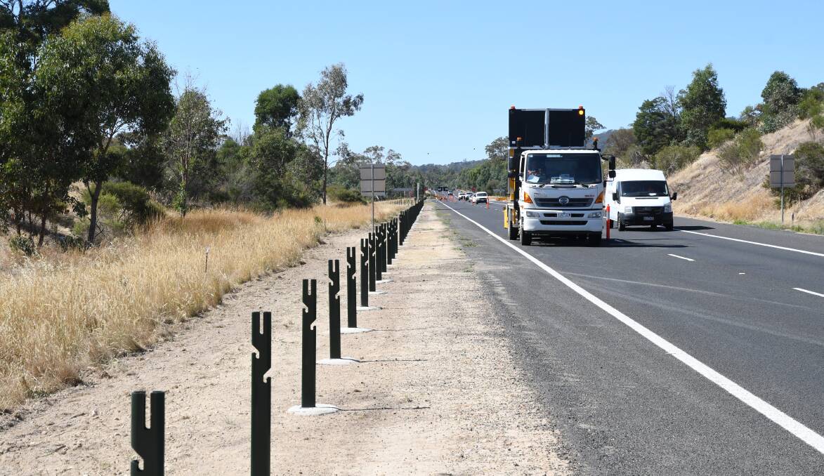 ROLLING OUT: More wire rope barriers are being installed on the Calder Highway from Bendigo to the Western Ring Road. The roads minister says opponents are "playing conspiracy theories". Picture: ADAM HOLMES