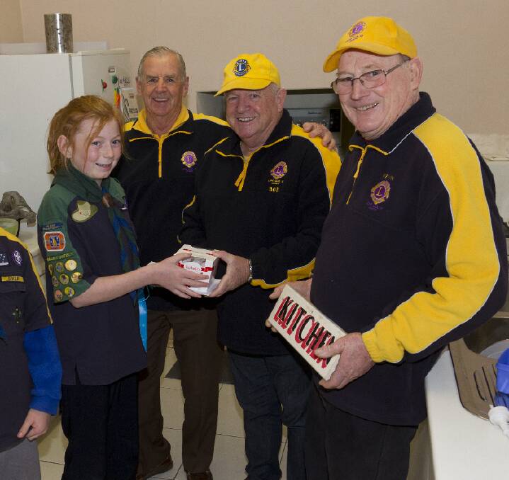 Scout Zoe thanks Lions Club of Ararat members Mick Thornbury, Bob Mullen and Kevin Hull for their work on the Scout Hall.
