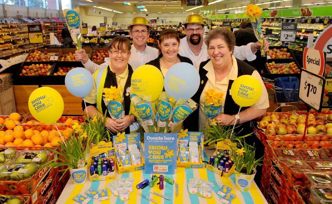 AWARENESS: Coles Horsham staff Deb Kuhn, Mark Mason, Roslyn Burns, Andy Tierney and Maria Marchesini on Daffodil Day 2015. Picture: SAMANTHA CAMARRI 