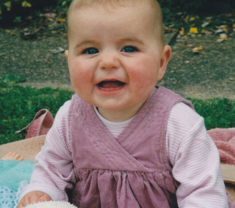 HAPY BABY: Alanna aged six months. This photo was taken just two days before she had her accident.