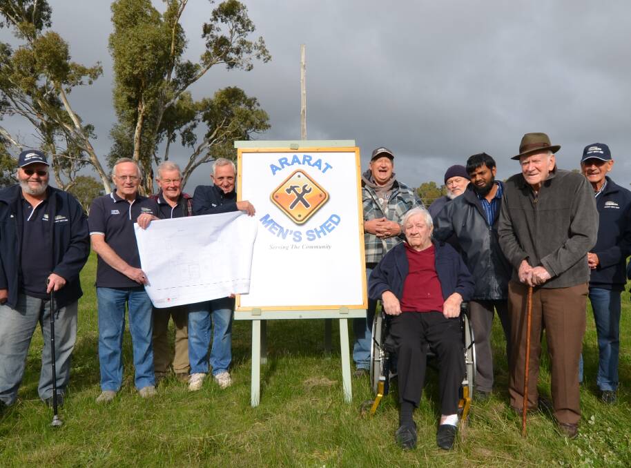 NEW BEGINNINGS: Members of the Ararat Men's Shed look over preliminary designs at the site of their new home at Kokoda Park.