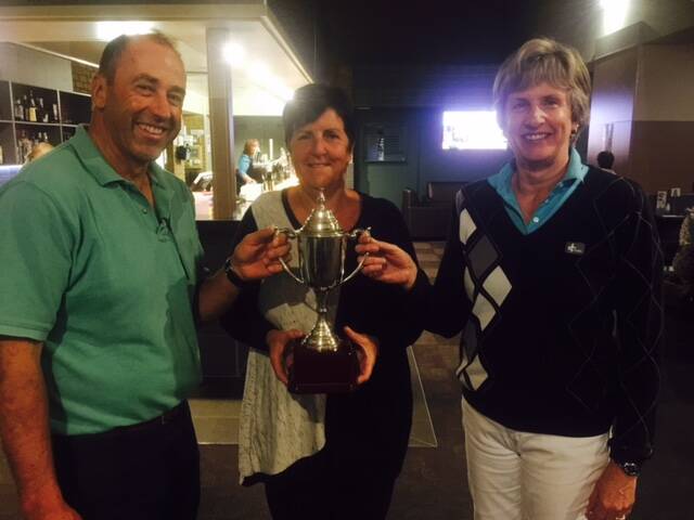 Chalambar men's president Charlie de Fegely and lady president Ruth Gellert (left) present winner of the handicap event, Gayle Dadswell with the trophy. Dadswell's partner, Michael Harricks, was absent. Picture: CONTRIBUTED  
