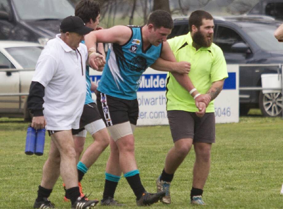 BAD DAY: Pumas' forward Lachie Hamilton had to be helped from the field in last Sunday's elimination final at Derrinallum. The reigning premiers, Moyston/Willaura lost to the Rams by 39 points. Picture: PETER PICKERING 