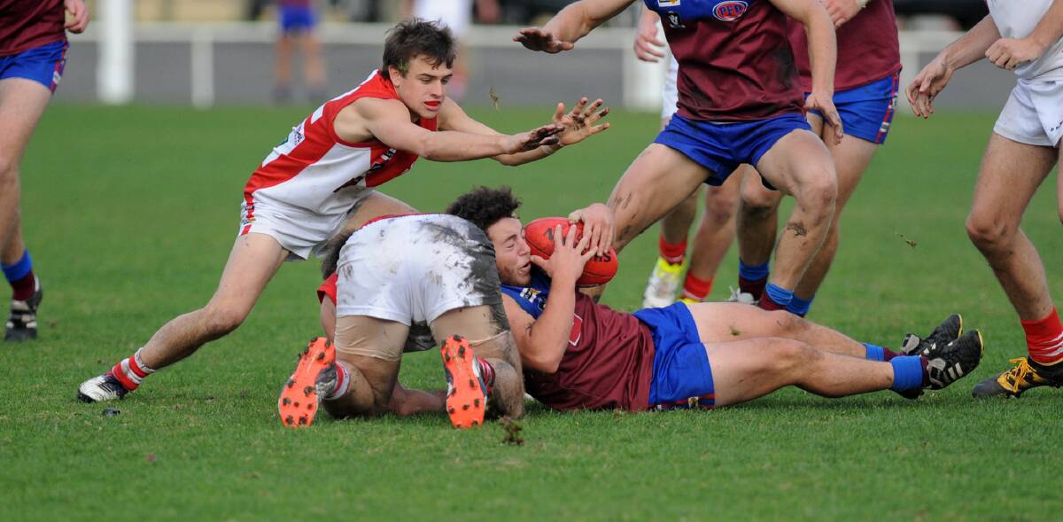 CONTESTED BALL: Horsham Demon Baillie Batchelor wins the contested football at ground level in the Demons win over Ararat. Pictures: SAMANTHA CAMARRI 