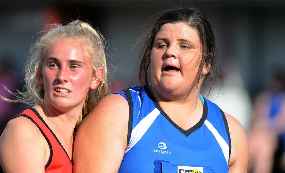 Stepping up: Stawell Warriors under 17 player Tash Reading steps up to seniors and plays against Kirby Knight of Minyip Murtoa.