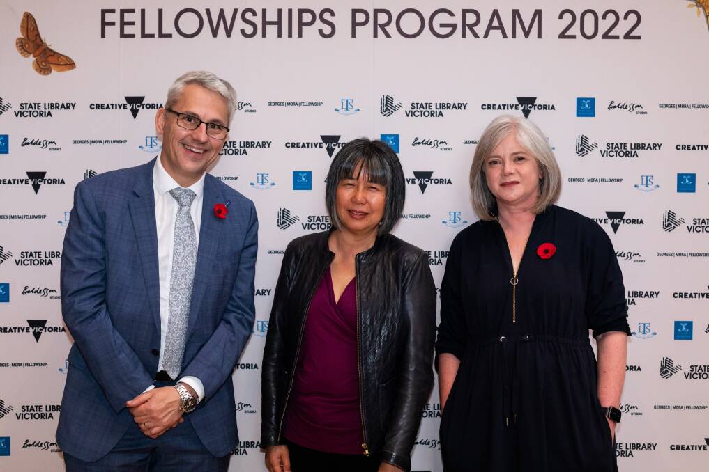 Alison Wong (centre) accepts her fellowship at an event with Victorian minister for creative industries Danny Pearson and State Library of Victora acting chief executive Sara Slade. Picture: SUPPLIED