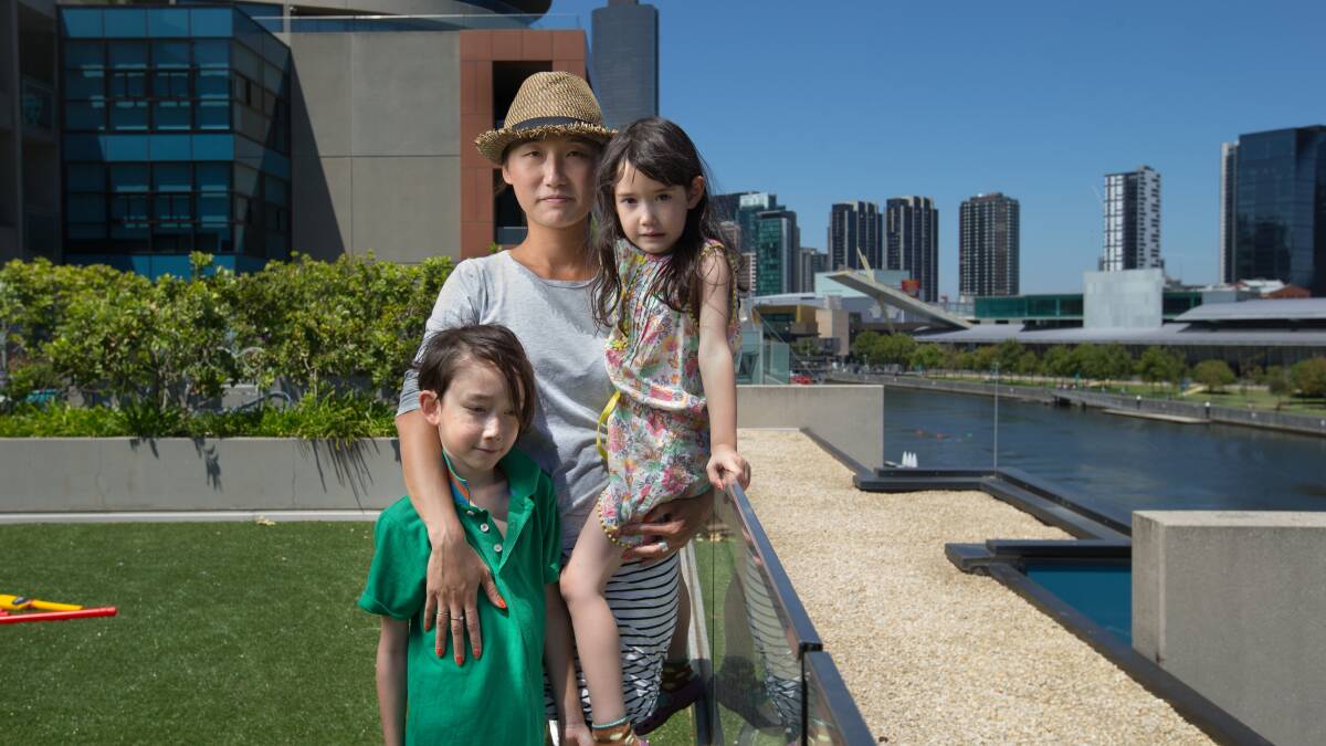 Denise Fung-Henderson, with children Will, 8, and Poppy, 6, is campaigning for a school in the Docklands. Photo: Simon Schluter