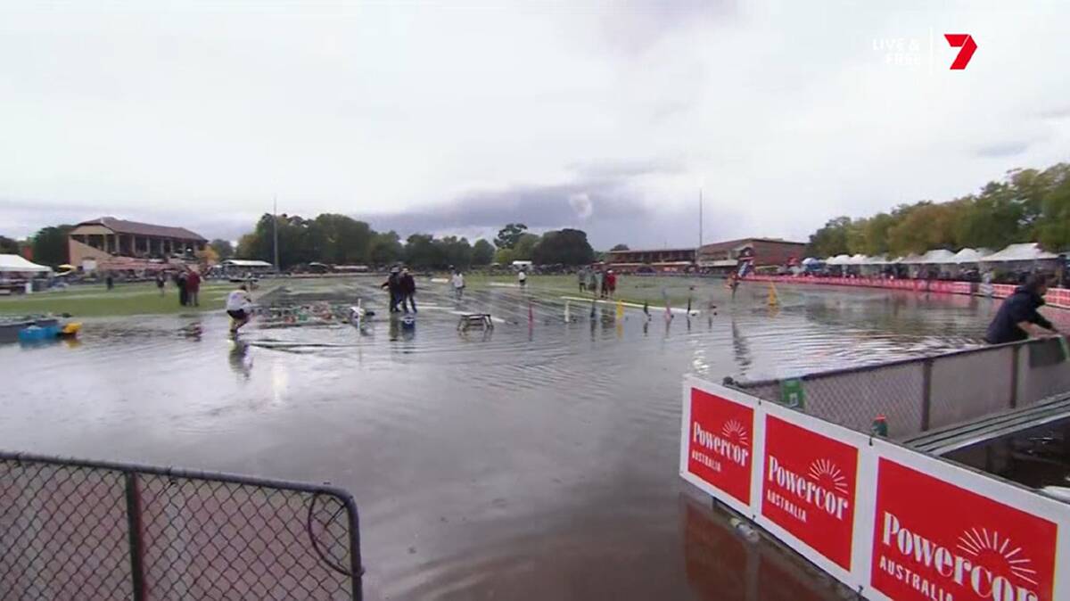 The official mop-up is on as crews work to clear the track for the 142nd running of the Stawell Gift final. Picture Channel 7