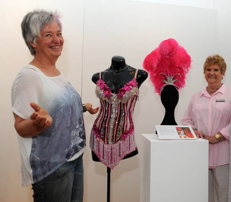 DIVA DELIVERY: Ararat's Sue Kennedy and councillor Gwenda Allgood get a sneak preview of Kylie costuming. More will come to town next year as part of a redeveloped arts precinct exhibition. Picture: Olivia Page