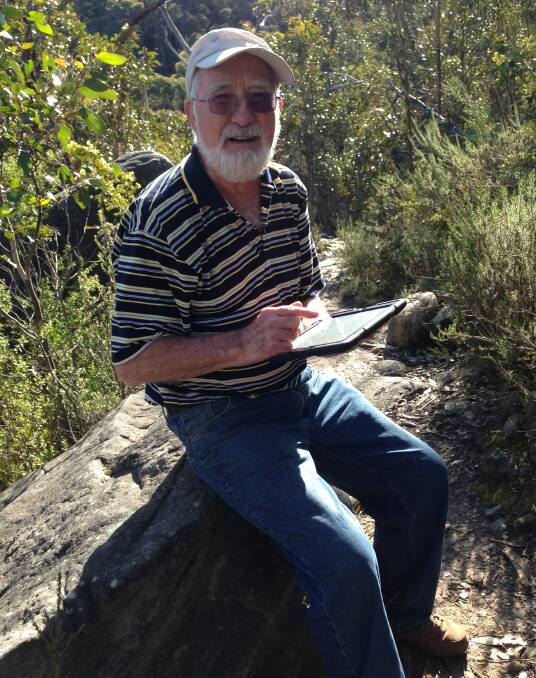 Age no barrier: Jim, aged 79, with his ipad during a walk to Sundial Peak in the spectacular Grampians National Park.