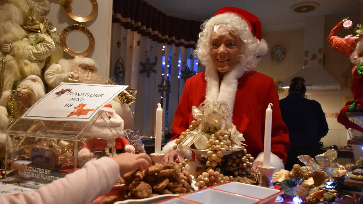 Mary Kartesz-Wardroper shares Christmas treats with the many visitors who flock to her Meadow Springs home. Alan and Mary use the season to raise money for K9. Photo by Caitlyn Rintoul.