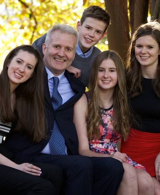 FAMILY MAN: Former basketball champion Andrew Gaze with his children in 2014, the year he was announced as Australian Father of the Year. 