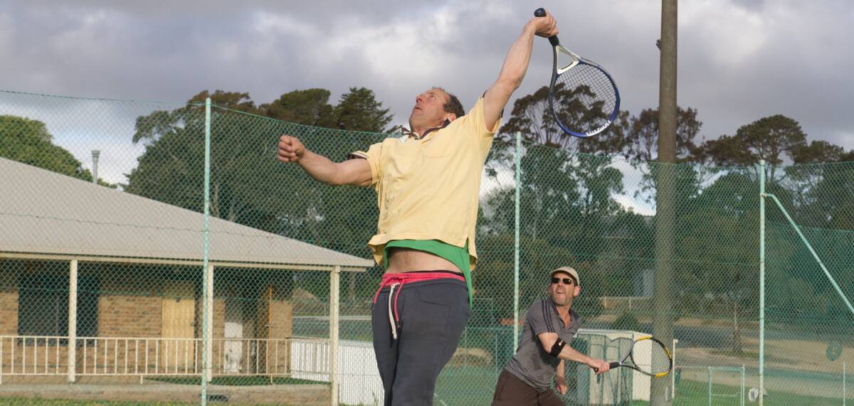 REACH: Michael Hope reaches for a high ball during Ararat City Tennis Club's Wednesday night tennis competition. Picture: Peter Pickering