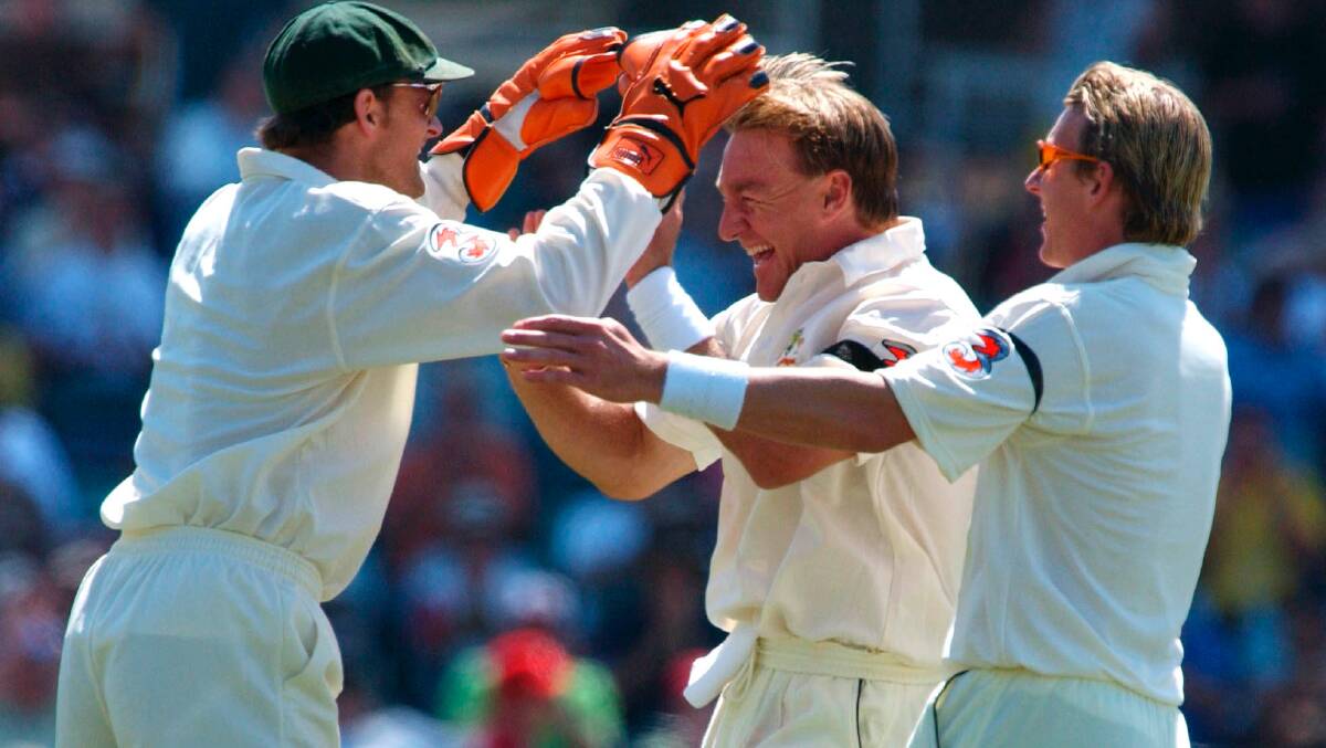Andy Bichel celebrates a wicket with Adam Gilchrist and Brett Lee during one of his 19 tests for Australia. Picture: AAP