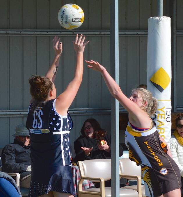 PRESSURE: Eagles B Grade goal shooter Holly Leggett gets plenty of attention from her opponent as she shoots at goal earlier in 2016. Picture: JODIE-LEE WELLS