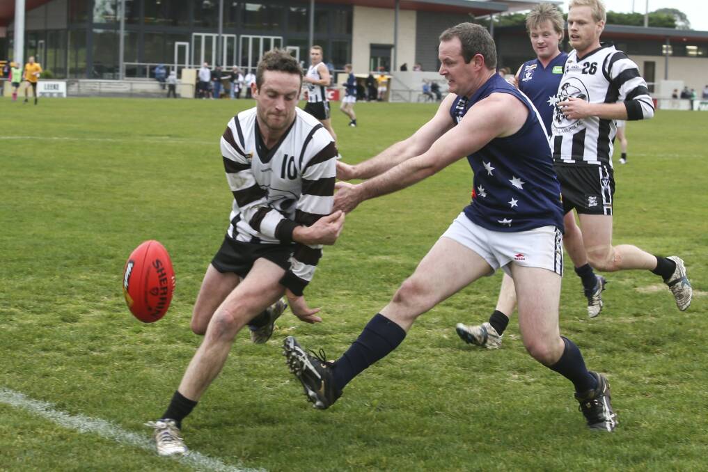 STRONG: Wickliffe-Lake Bolac's Julian Cameron and Ararat Eagle Dan O'Connell take the ball to the boundary during a 2016 match. The Magpies are expected to contend again in 2017. Picture: Peter Pickering