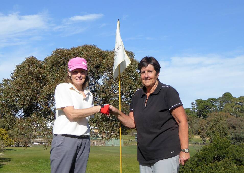 WINNER: Rene Hamilton is congratulated by Gayle Dadswell after winning the par three crown at Chalambar Golf Club.