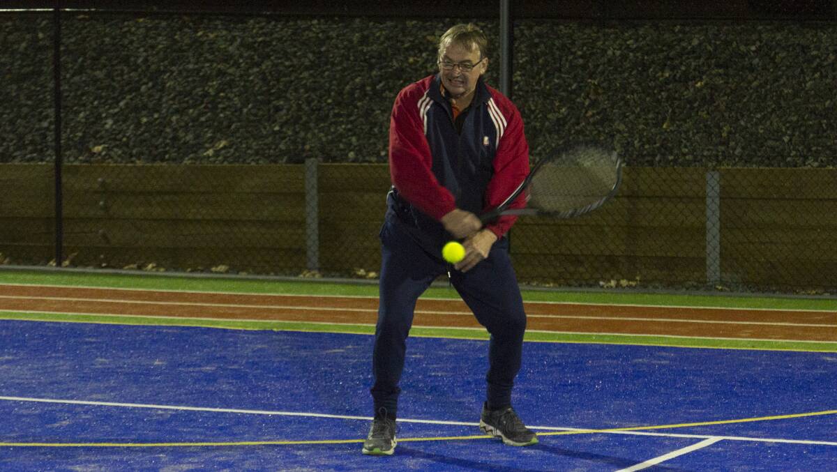 SET: Carl Barry lines up his return shot during a previous match of tennis in the Wednesday night competition. Picture: Peter Pickering