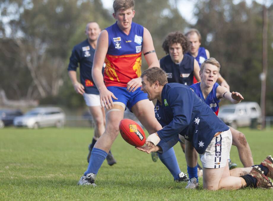 BROKEN: The Ararat Eagles broke their winless streak when they won their first game of the year against Great Western. Brent Bulger hand passes to safety. Picture: PETER PICKERING