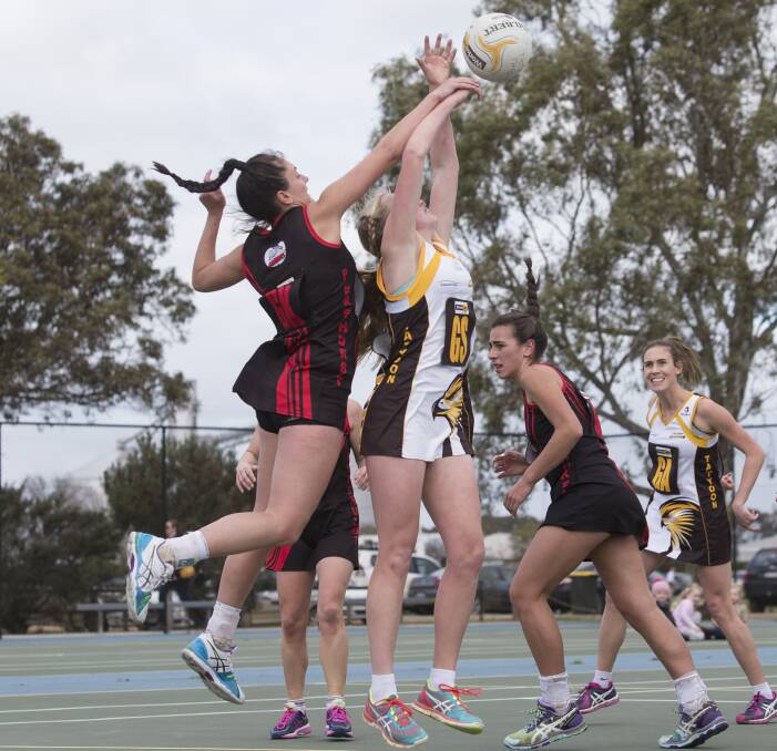 Hawks A Grade goal shooter Maggie Astbury at full stretch. Picture: PETER PICKERING