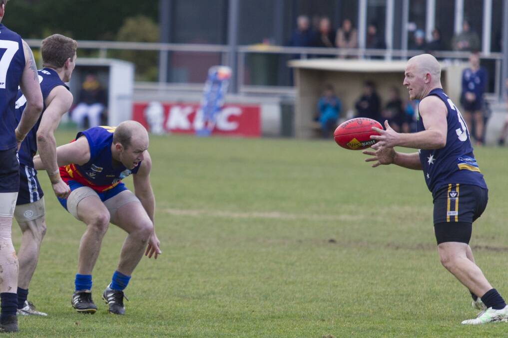 CLEAR SPACE: Ararat Eagle Jesse Hutchins gets possession against Great Western in round 15. Picture: Peter Pickering