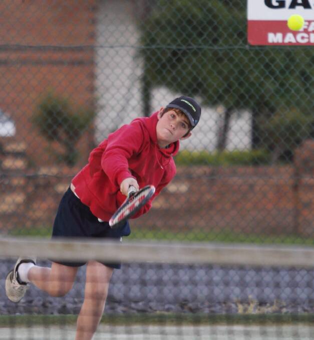 POWERFUL: Tim Hartwich shows some style as he serves the ball earlier in the Wednesday night tennis season. Picture: Peter Pickering