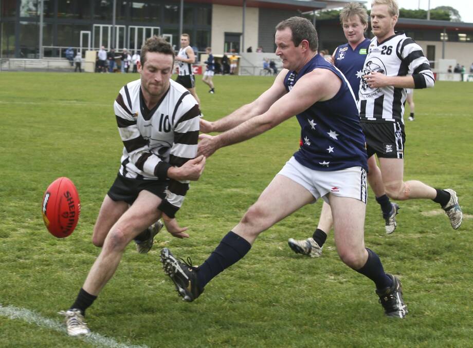 OUT OF PLAY: Julian Cameron tries to keep the ball in play during Wickliffe-Lake Bolac's win over Ararat Eagles on Saturday. Picture: PETER PICKERING