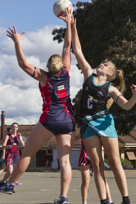 UP FOR GRABS: Laharum's Erin Mellington and Swifts' Drew Smith in a contest for the ball during the A Grade match on Saturday. Picture: Peter Pickering