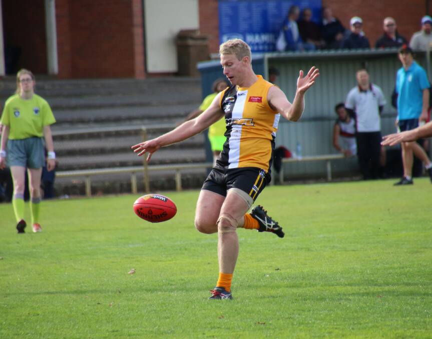 SPACE: Tatyoon's Tim McDougall gets his kick away for the Mininera team during the interleague clash against South West. Picture: Tracey Kruger